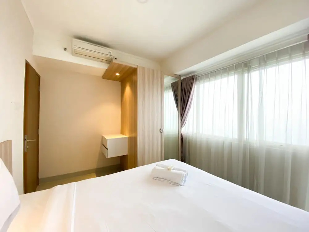 Cozy and Minimalist 2BR at 8th Floor The Oasis Cikarang Apartment By Travelio