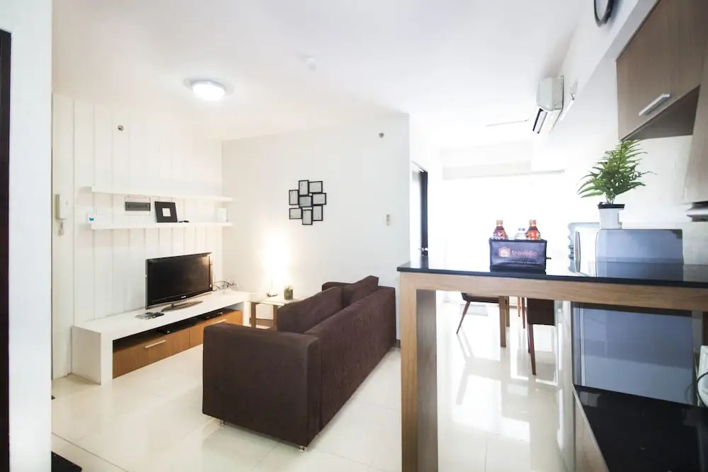 2BR Cozy at Empyreal Epicentrum Apartment By Travelio