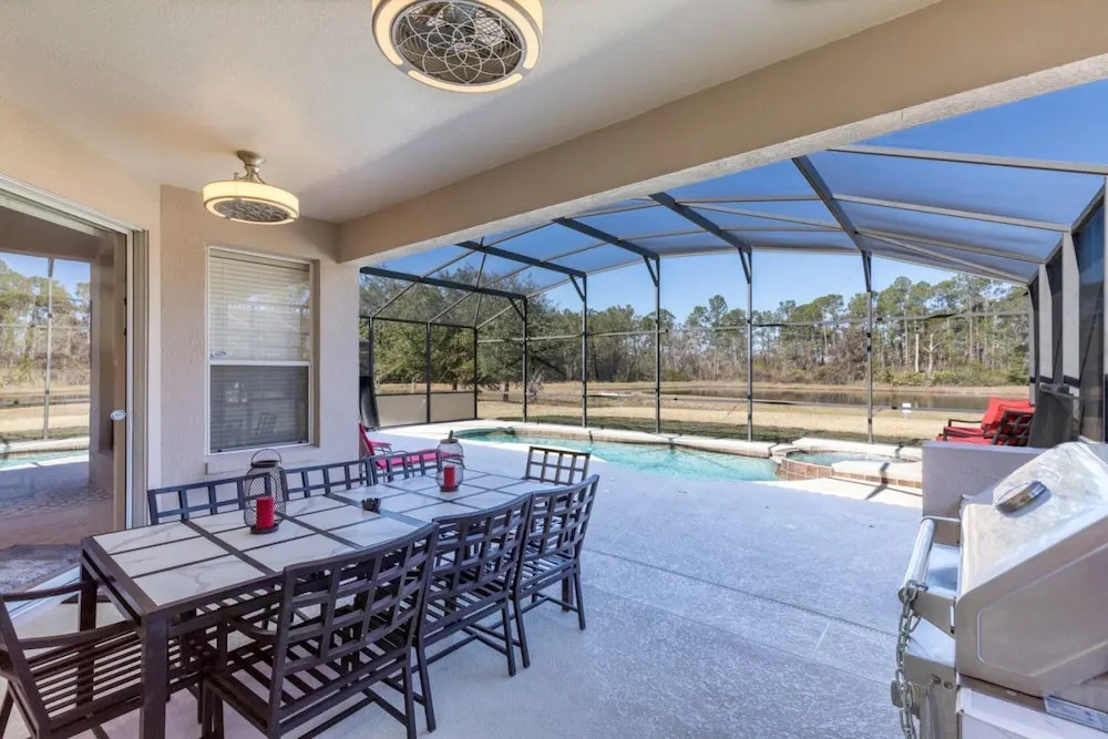 Extended Sunny Pool Deck with Pool and Spa and Lake View in Gated Solterra Resort