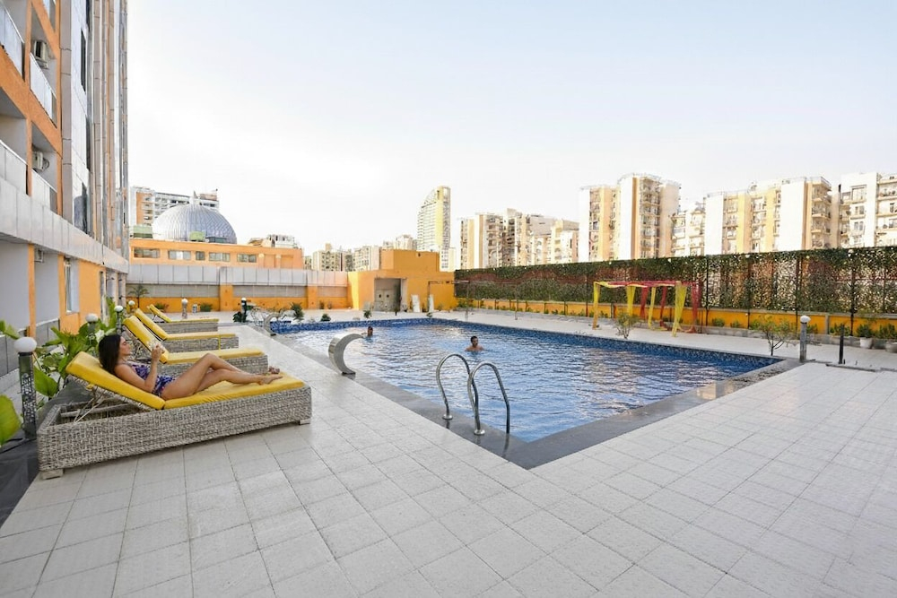 FabHotel Prime Spectrum Metro - With Pool | 5 mins Walk from Sector 75 Metro