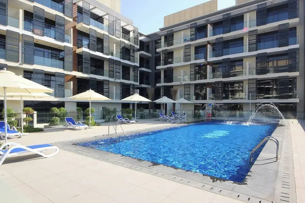 Manzil-Stylish 1BR with Maid room in JVC