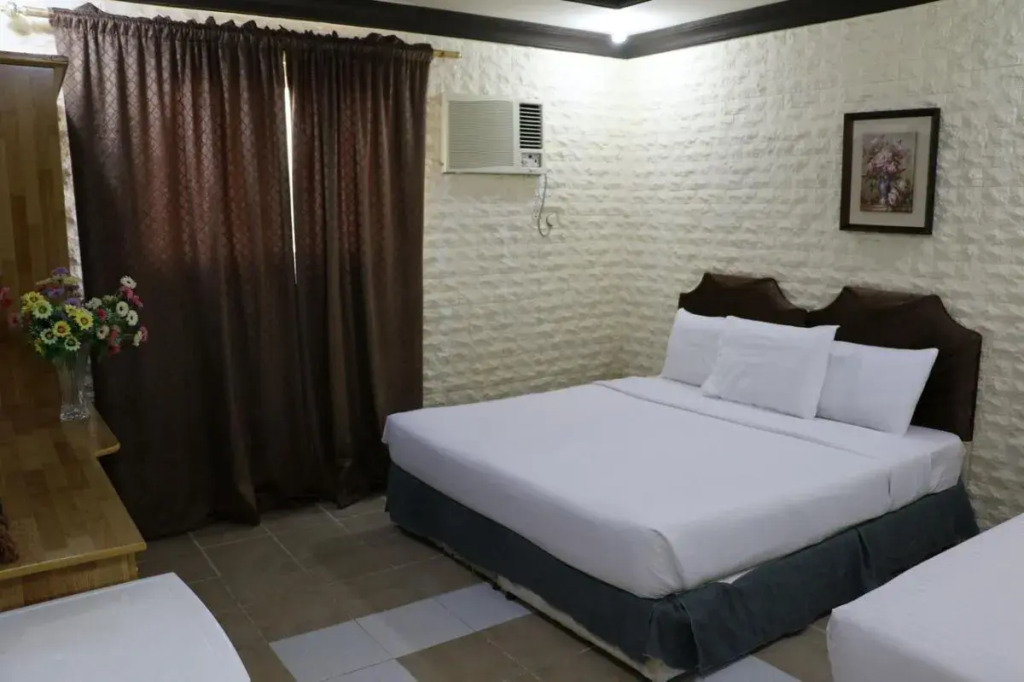 Al Alya Hotel Rooms and Suites