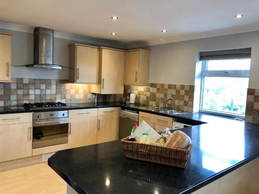 AB - Top floor 2 bed modern town centre apartment with parking for one vehicle