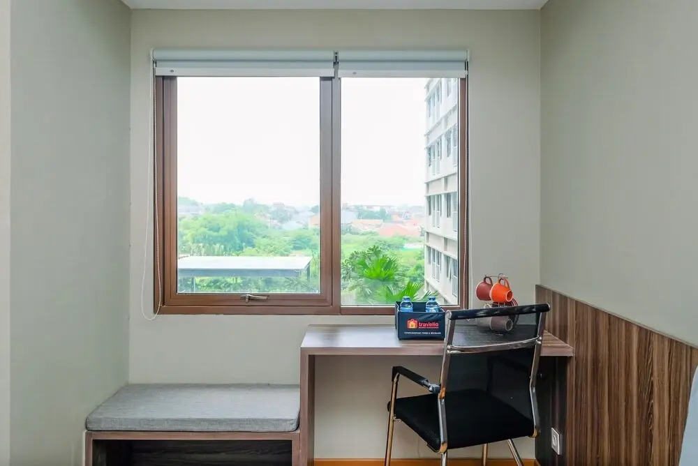 Comfortable Pool View Studio Room at Gateway Park LRT City Jatibening Apartment By Travelio