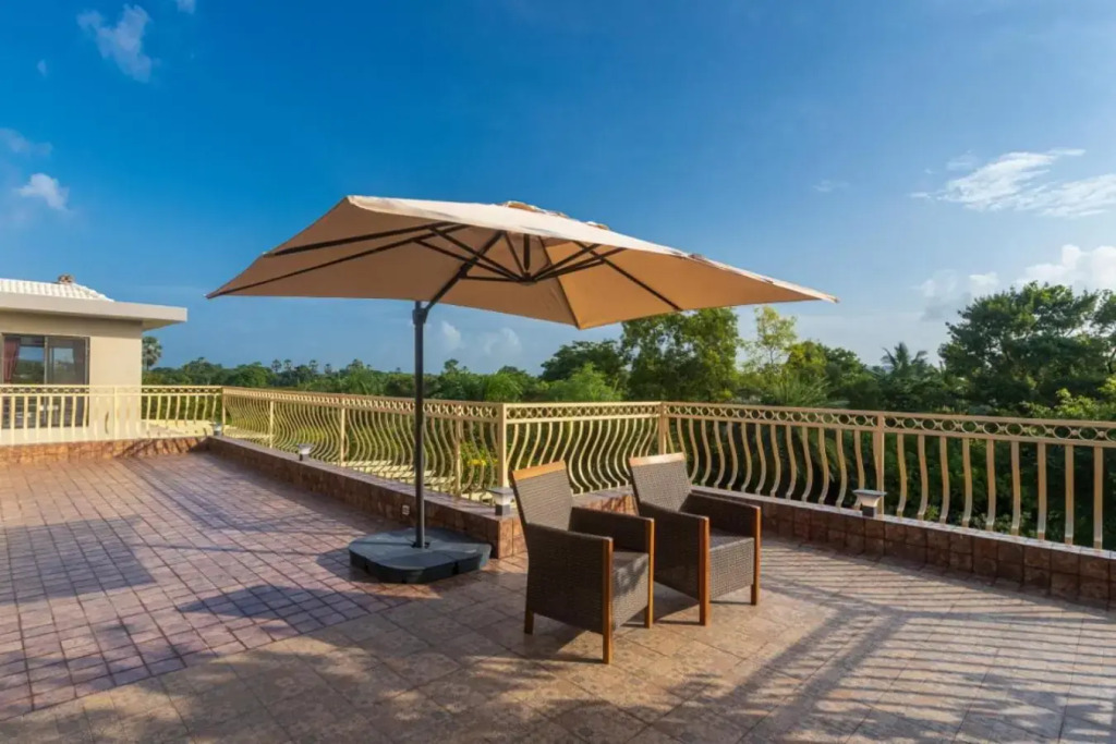 SaffronStays Aura, 4 BR Luxury Pool Villa with Game Room & Lawn