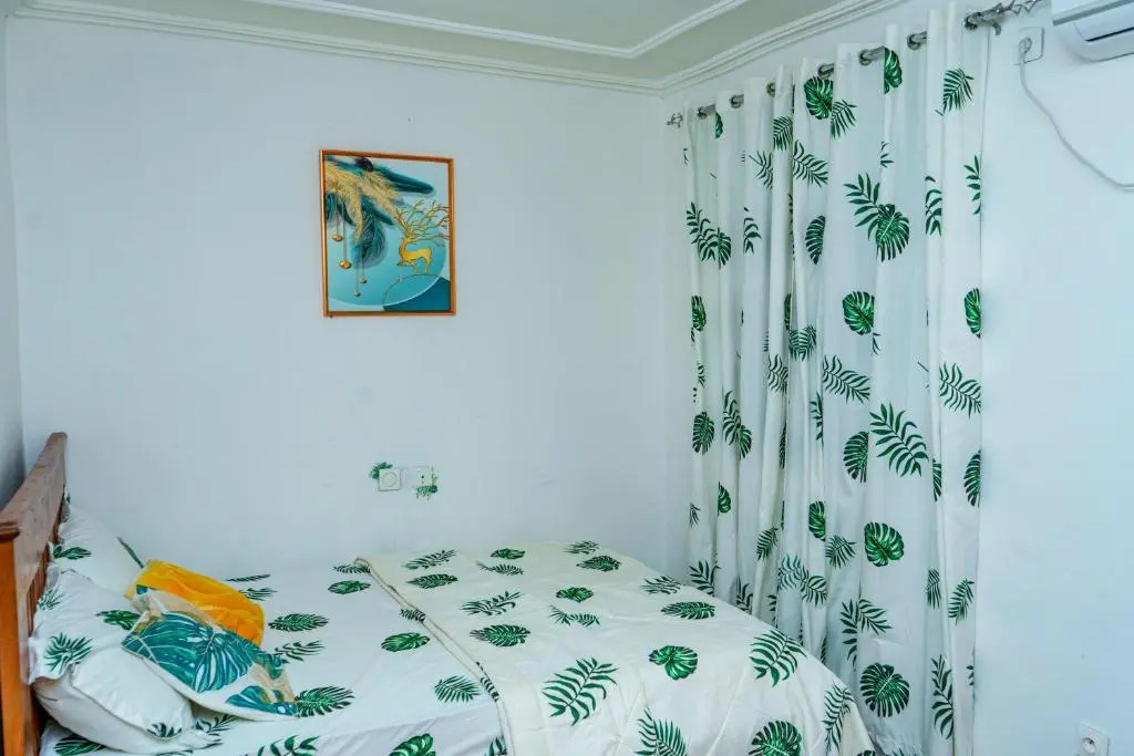 NAIVELI-PALM Appartement meublé sobre et chic