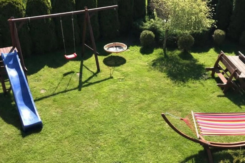 Half of holiday home, terrace, playground