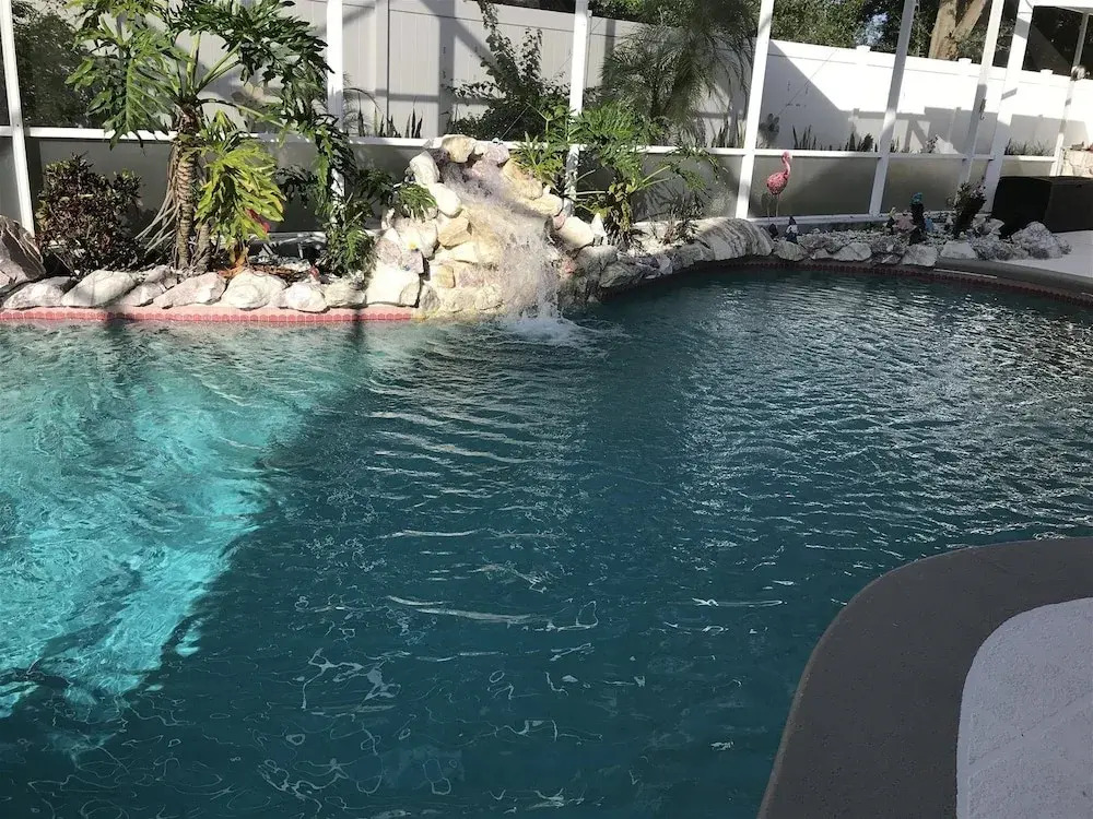 3 Bedroom Home With Private Screened Pool With Rock Waterfall Feature and Gameroom by Florida Dream Homes
