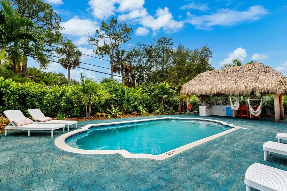 Eccentric Home With Pool Tiki hut Outdoor Kitchen