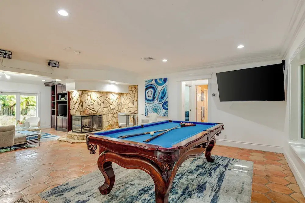 5mins to Beach Pool + Hot Tub Billiards Coral Ridge Getaway by Avantstay
