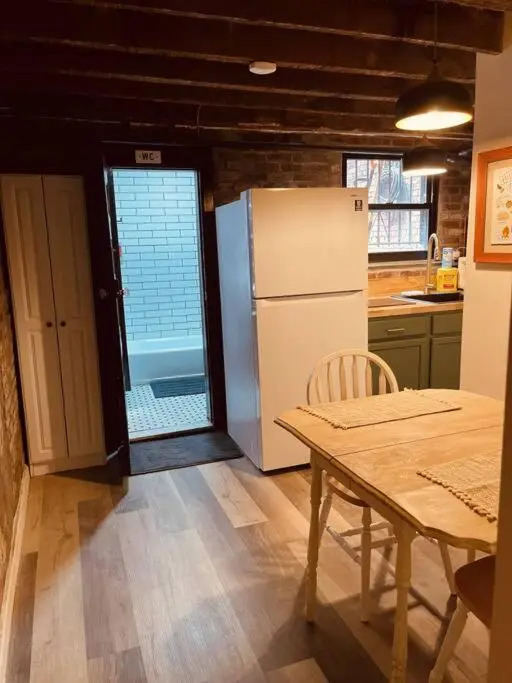 1850s historic Row House 7min train to NYC with private backyard