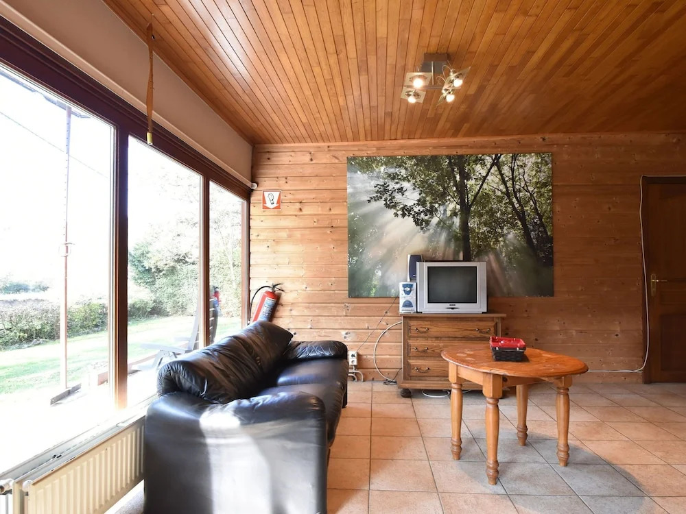 Nestled In A Green Scenery, This Chalet Along The River Is Perfect To Chill Out!