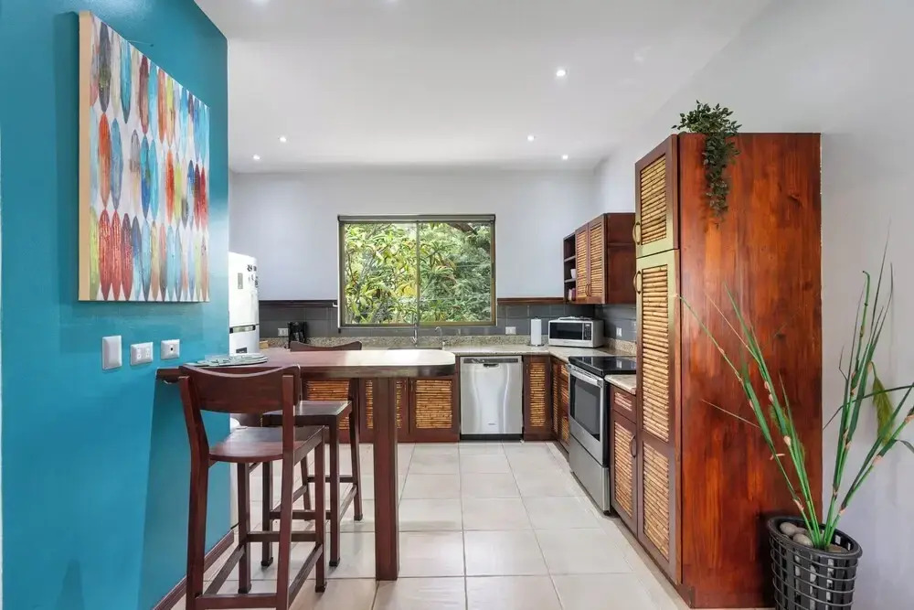 Modern Island-Themed Condo with Floor-to-Ceiling Windows & Garden and Pool Views Within Walking Distance of the Beach