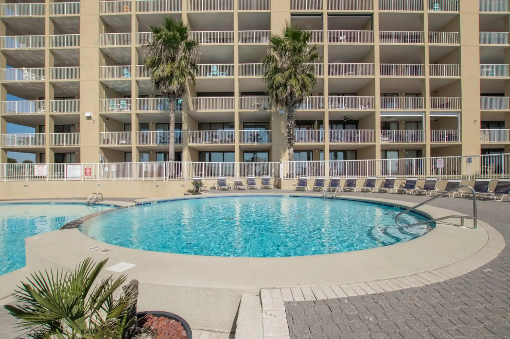 Gorgeous ground floor condo with private balcony steps from pool
