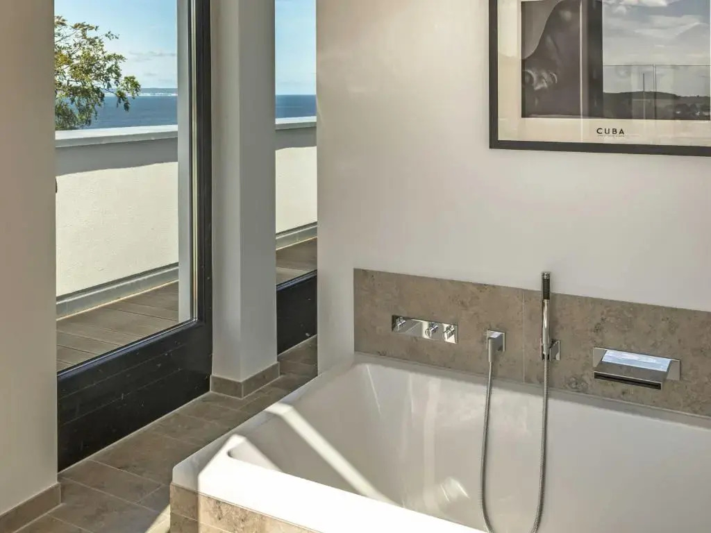 Villa Philine - Penthouse 28 mit Panoramablick, Pool, SPA & Kamin