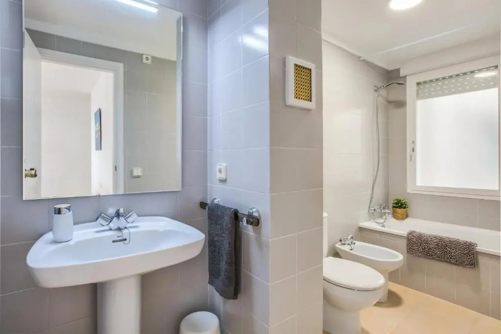 Lets Holidays White Apartment with Terrace, AC & Parking, Near Beach