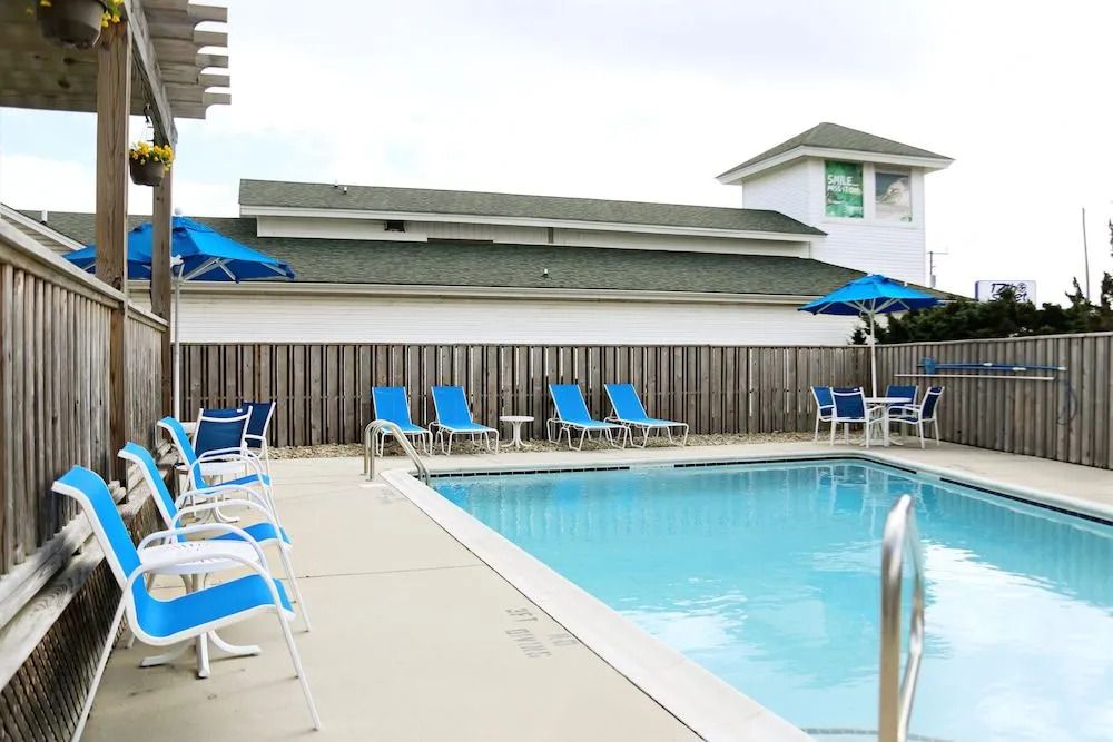 NEW 2026-Ocean Sands Beach Boutique Inn-24Hr Sauna and Salt-Mineral Pool-Free Beach Bikes and Famous Beach-Fresh Baked Cookies-Popcorn-In Room Bathrobes-Sunscreen-65 Inch TVsNetflix-Bedside Candy-Free Laundry- 4 Grand Black Beds-Call & Save-1-252-AHA-SAND