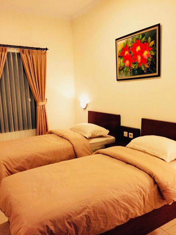 Adiputra Guesthouse Tata Bumi by HomiQ