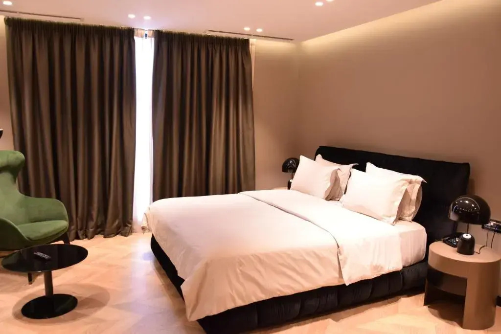 Отель The Unik
