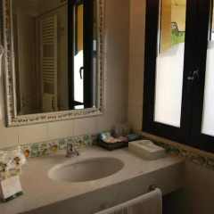 Отель Sangiorgio Resort & Spa Италия, Кутрофьяно - отзывы, цены и фото номеров - забронировать отель Sangiorgio Resort & Spa онлайн ванная фото 2