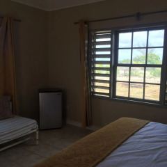 Отель Captain's Cove Beach Resort & Villas удобства в номере фото 2