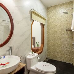 Отель Flame Flowers Homestay ванная фото 2