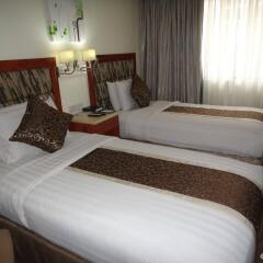 Отель Diamond Suites And Residences Филиппины, Лапу-Лапу - 1 отзыв об отеле, цены и фото номеров - забронировать отель Diamond Suites And Residences онлайн комната для гостей фото 3
