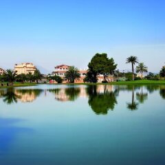 Отель Apartamentos y Villas Oliva Nova Golf Resort Испания, Олива - отзывы, цены и фото номеров - забронировать отель Apartamentos y Villas Oliva Nova Golf Resort онлайн приотельная территория