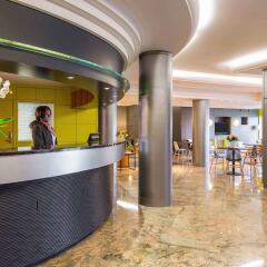 Отель Aparthotel Adagio Genève Saint Genis Pouilly Франция, Туари - отзывы, цены и фото номеров - забронировать отель Aparthotel Adagio Genève Saint Genis Pouilly онлайн интерьер отеля фото 2