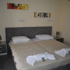 Апартаменты Nikos Apartments комната для гостей фото 2