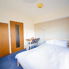 Апартаменты Hakata Apartment Хаката комната для гостей фото 2