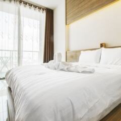 Отель Riviera Wongamat Condo By Favstay Паттайя комната для гостей