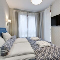 Апартаменты Lion Apartments -Aquarius Deluxe комната для гостей фото 4
