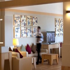 Отель Baia Chia - Chia Laguna Resort Италия, Домус-де-Мария - отзывы, цены и фото номеров - забронировать отель Baia Chia - Chia Laguna Resort онлайн интерьер отеля фото 2