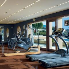 Отель Grand Resort Lagonissi фитнесс-зал фото 3