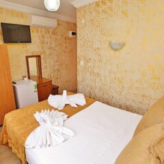 Апартаменты Camelot Apartment комната для гостей