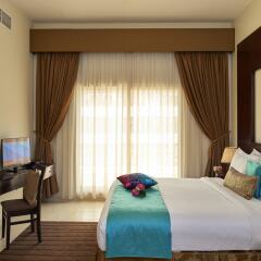 Arabian Dreams Deluxe Hotel Apartments комната для гостей