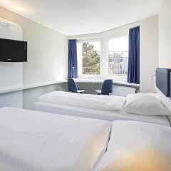 Отель Welcome Inn Zurich Airport Швейцария, Клотен - 1 отзыв об отеле, цены и фото номеров - забронировать отель Welcome Inn Zurich Airport онлайн комната для гостей фото 4