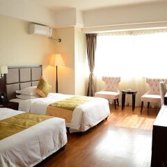 Отель Sweetome Vacation Rentals Wanda Plaza Китай, Сямынь - отзывы, цены и фото номеров - забронировать отель Sweetome Vacation Rentals Wanda Plaza онлайн комната для гостей фото 3