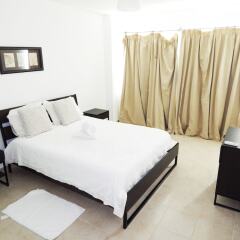 Отель Sunny apartment at the beach with pool Доминикана, Пунта Кана - отзывы, цены и фото номеров - забронировать отель Sunny apartment at the beach with pool онлайн комната для гостей фото 2