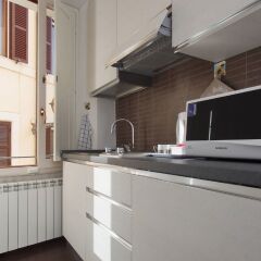 Отель Central Rome Suites в номере