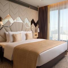Гостиница Double Tree By Hilton Minsk комната для гостей фото 4