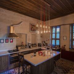 Отель Asuwari Suites Cappadocia в номере