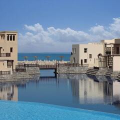 Отель The Cove Rotana Resort бассейн фото 4