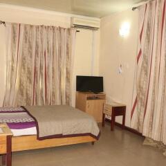 Отель Planet Guest House Калабар комната для гостей