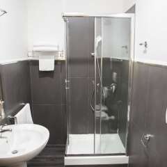 Отель Inn Rome Rooms & Suites ванная фото 4