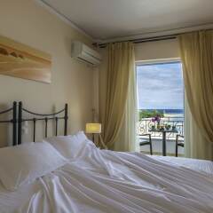 Отель Oasis Beach Hotel Греция, Агистри - отзывы, цены и фото номеров - забронировать отель Oasis Beach Hotel онлайн комната для гостей фото 3