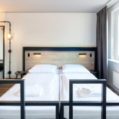 Отель a&o Berlin Mitte Германия, Берлин - 4 отзыва об отеле, цены и фото номеров - забронировать отель a&o Berlin Mitte онлайн комната для гостей фото 2