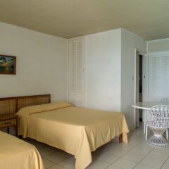 Отель Sunset Beach Studio At Montego Bay Club Resort Ямайка, Монтего-Бей - отзывы, цены и фото номеров - забронировать отель Sunset Beach Studio At Montego Bay Club Resort онлайн комната для гостей фото 4
