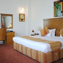 Ramee Guestline Hotel комната для гостей